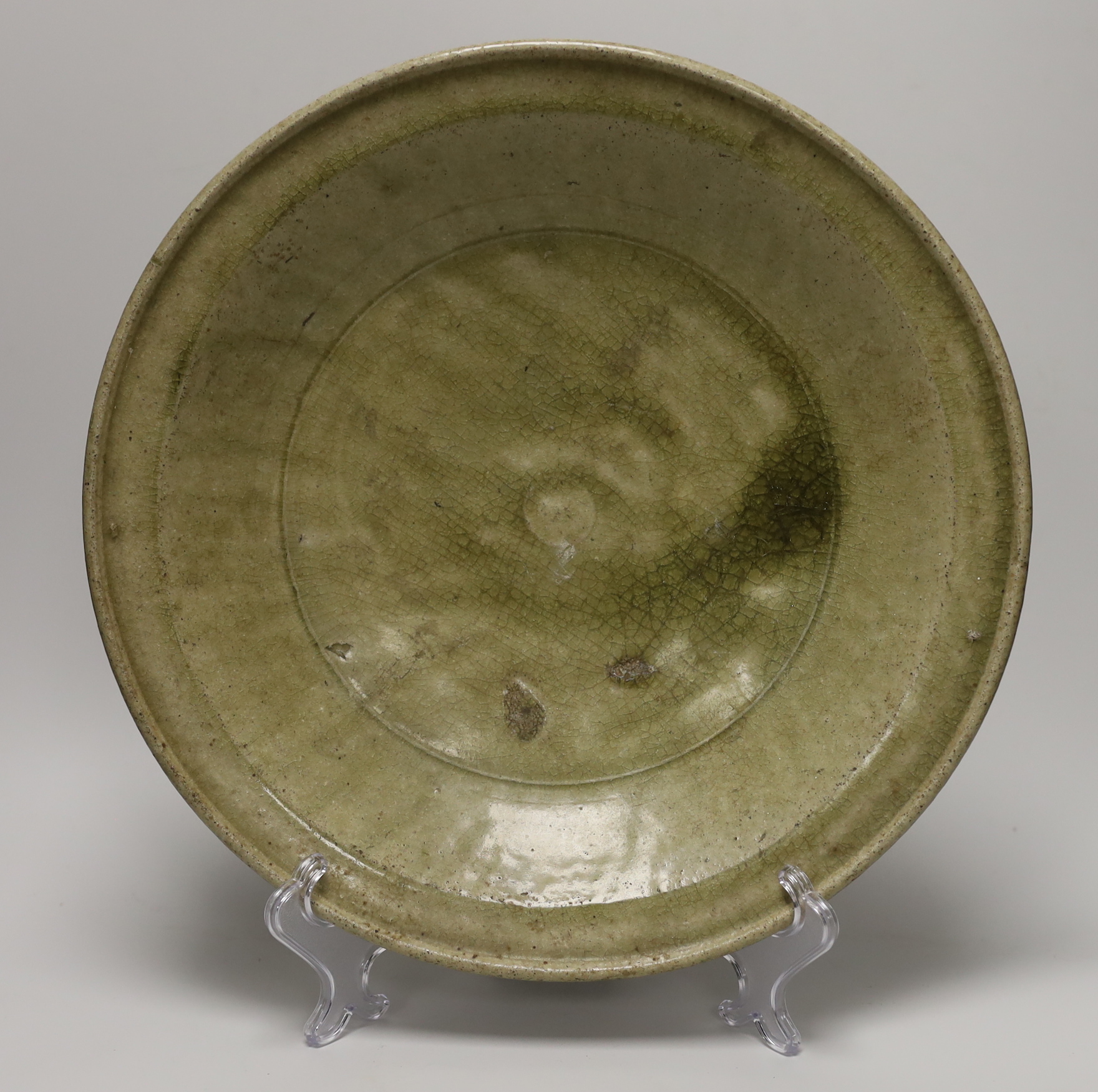 A Thai Sawankhalok celadon dish, 35cm, four rice and tea bowls and a double gourd vase